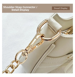 Macro detail of the golden strap connection buckle and V-shaped quilted leather texture