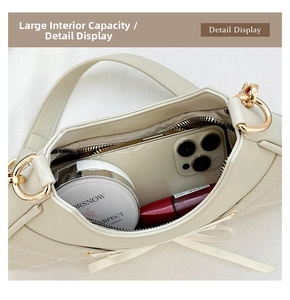 Top view of cream ballet bow shoulder bag showing spacious interior for phone and makeup