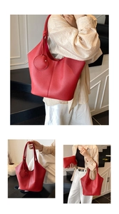 Macro detail of red lychee textured tote bag with knot strap and matching pouch set
