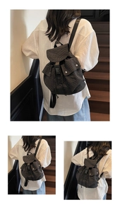 Detail of checkered canvas backpack showing front buckle straps and side flap pockets