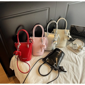 Collection of mini bucket bags in five colors with cute animal charms and leather texture