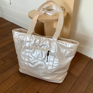 Glossy off-white large capacity tote bag with front zipper and reinforced handles