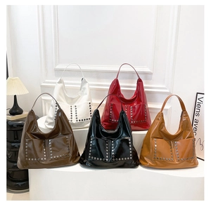 Collection of oversized stud-embellished patent leather tote bags in five vibrant colors