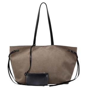 Large brown canvas tote bag with black straps and matching small pouch for women