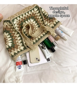 Detail of crochet tote bag showing spacious interior and grandmother square pattern