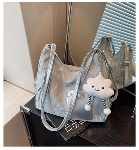 Silver wrinkled faux leather tote bag detail with metallic pocket and cloud charm