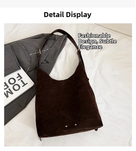 Detail of dark brown matte suede tote bag base with small gold protective metal studs