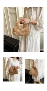 Detail of woven straw handbag with golden chain strap and integrated top handle