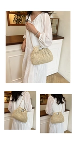 Detail view of woven straw cloud bag with gold chain strap and reinforced handle