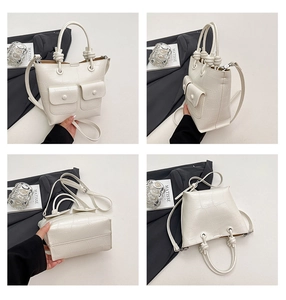 Detailed views of a white crocodile pattern Boston bag with dual pockets and knot handle