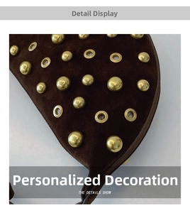Detailed macro view of dark brown suede material with golden studs and metal eyelets