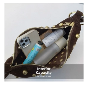 Top view of suede shoulder bag interior showing daily items like phone and cosmetics