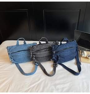 Detailed view of denim canvas bags in light blue, dark blue, and vintage black colors