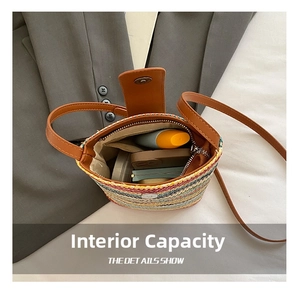 Internal capacity of hand-woven straw bucket bag with magnetic closure and essentials