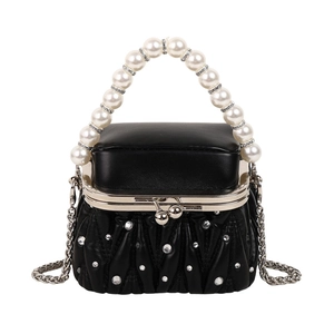 Mini black pleated leather bag with pearl handle and rhinestone accents on white background