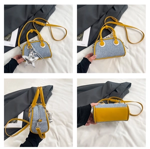 Detailed views of small denim and yellow leather bowling bag with a silver star charm