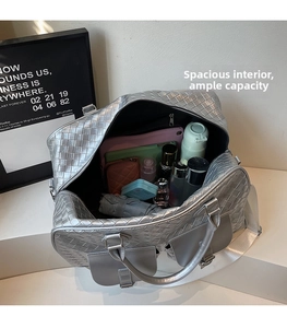 Detail view of woven travel bag with spacious interior for tablets and daily essentials