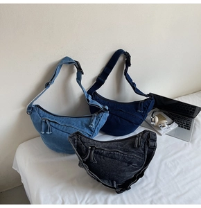 Three colors of denim crescent bags with adjustable straps and zipper pockets for daily use