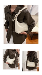 Detail of cream leather shoulder bag featuring aesthetic bow knot accent on the strap
