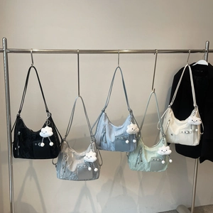 Fashionable wrinkled tote bags in five colors with cute cloud pendants on a display rack