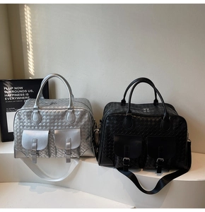 Detail of woven texture travel bags with flap pockets and adjustable straps