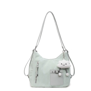Light green nylon tote bag with dual straps and a cute white cloud plush pendant charm