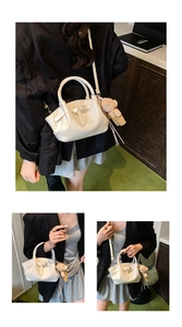 Macro detail of white croc-embossed handbag with cute bear charm and tassel ornament