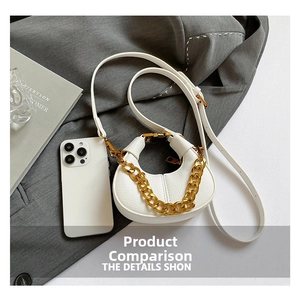 Detail of white pebble leather crescent bag with chunky gold chain and phone size comparison