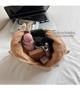 Macro shot showing spacious interior of beige crochet tote bag with large capacity storage