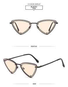 Detail of triangle metal sunglasses featuring hollow frame and decorative metal dots