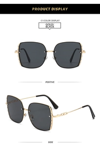 Detail view of square oversized sunglasses with diamond-encrusted frames and gold metal temples