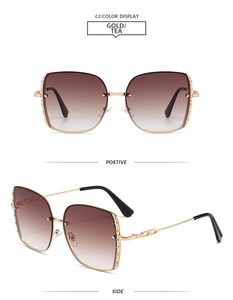 Detailed front and side view of gold metal square oversized sunglasses with rhinestones