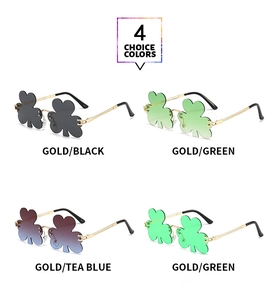 Detail view of four-color clover leaf shaped rimless sunglasses with gold metal temples