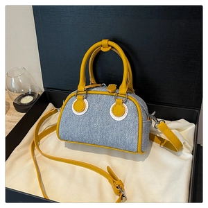 Mini denim Boston bag with yellow leather trim in a premium gift box presentation