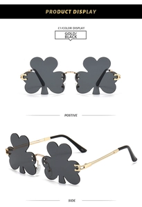 Front and side views of rimless clover-shaped sunglasses with gold temples and dark lenses