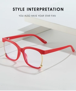 Detail view of red butterfly half-rim frames with elegant gold metal accents