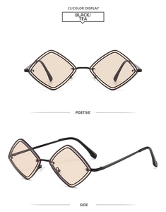 Détail de lunettes de soleil géométriques en métal noir avec verres couleur thé