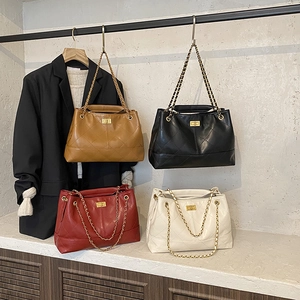 Quilted leather shoulder bags in four colors with chain straps and metal twist locks
