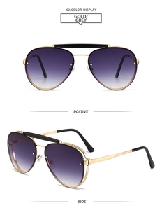 Detail view of gold metal pilot sunglasses with double bridge and gradient lenses