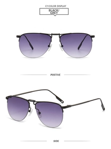 Detail view of double bridge pilot sunglasses with black frame and purple gradient lenses