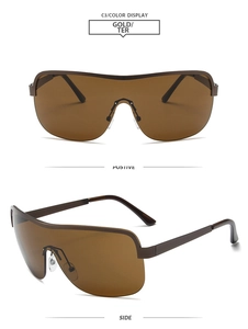 Détail de lunettes de soleil masque Y2K dorées et marron avec plaquettes de nez