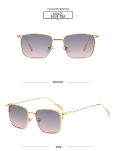 Details einer quadratischen goldenen Metall-Sonnenbrille mit blauem Verlaufsglas-Detail