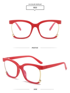 Macro detail of red square owl frames with gold accents and anti-blue light lenses