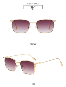 Detailansicht der quadratischen Metall-Sonnenbrille mit Goldrahmen und Teeverlauf