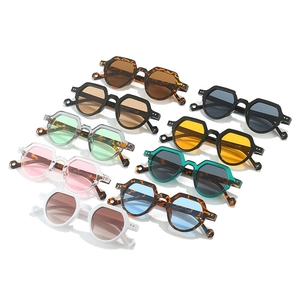 Top view of retro oval sunglasses collection showing nine diverse color frames and lenses