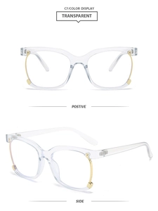 Detail view of transparent square frames with gold metal decorative temple accents
