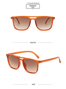Detail of orange aviator sunglasses featuring double-bridge frame and tea gradient lenses