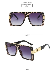 Detail of tortoiseshell square oversized sunglasses with gold metal logo and gradient lenses