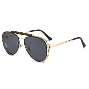 Vintage gold metal double bridge aviator sunglasses with intricate engraved details and gray lenses