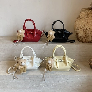 Elegant crocodile pattern handbag collection with plush bear charms in four colors